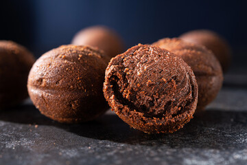 Tasty chocolate balls on a stone dark table.