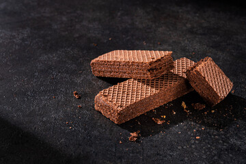 Chocolate waffles on a dark stone table