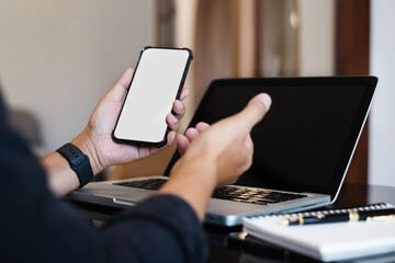 Smartphone screen, hand Male work using smartphone and laptop.with white background for advertising, contact business search information on desk in cafe.