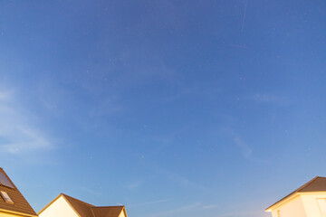 Starry sky over a housing settlement with meteorites (Perseids in August)