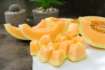 sliced of melons, fresh Melon or cantaloupe, Cantaloupe melons on wood background, Favorite fruit in summer