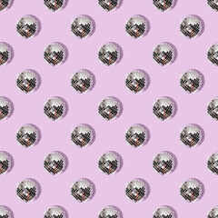 Seamless pattern with mirrored disco balls on a lilac background