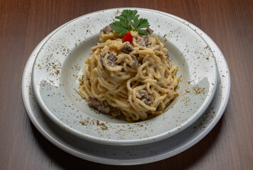 Spaghetti with four cheese sauce and filet mignon
