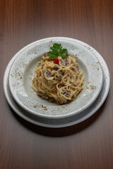 Spaghetti with four cheese sauce and filet mignon