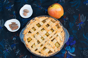 Home made and healthy baked apple pie in glass plate with beautiful background.