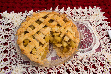 Home made and healthy baked apple pie in glass plate with beautiful gray and white background.