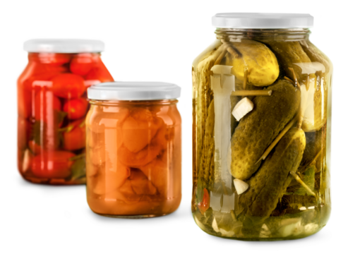 Jars with canned vegetables isolated on white