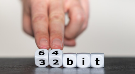 Hand turns dice and changes the expression '32 bit' to '64 bit'.