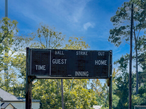 Vintage Analog Scoreboard At A Little League Baseball Playing Field.