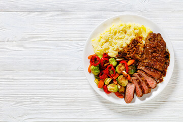 beef steak with potato mash and roasted vegetables
