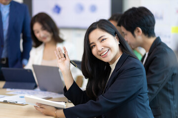 Portrait of a attractive business woman in a business office meeting room.