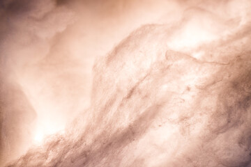 Abstract image made using colored light and cotton snow, artificial snow. Dramatic concept of...