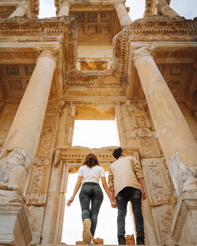 Tourists in front of ruins of Library of Celsus