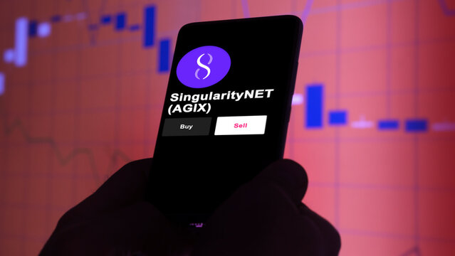An investor's analyzing the SingularityNET $AGIX coin on screen. A phone shows the AGIX's prices to invest
