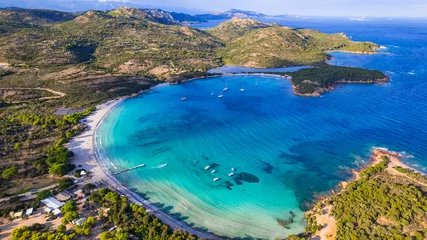 Foto auf Glas Best beaches of Corsica island - aerial panoramic view of beautiful Rondinara beach with perfect round shape and crystal turquoise sea.. © Freesurf