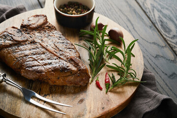 Raw steak t-bone or porterhouse. Steak t-bone or porterhouse in sauce with spices, salt and...