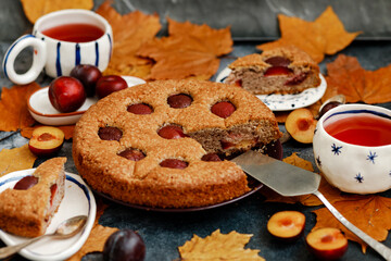 Plum pie. Delicious pie on a concrete table. Autumn design