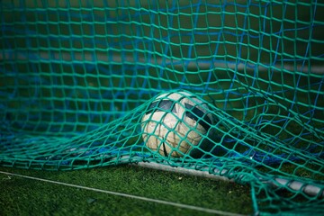 Soccer ball under nets on the field