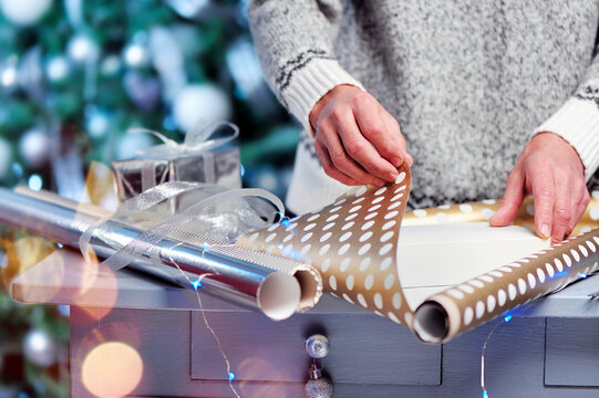 Closeup Picture Of A Present Being Wrapped In A Present Paper