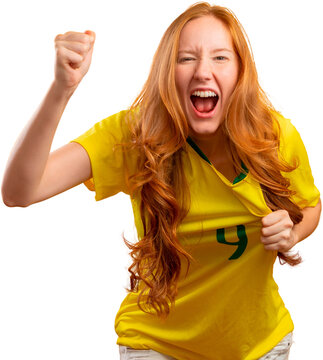 Brazil supporter. Brazilian redhead woman fan celebrating on soccer, football match on transparent background. Brazil colors. PNG