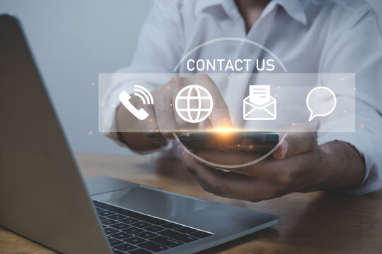 Contact Us. people hand touching on mobile smart phone and computer with virtual social media icon diagram, business finance, internet data technology, digital marketing, social network concept