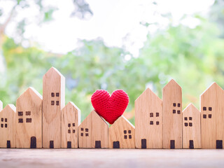 Miniature house with red hear. Investment property concept.