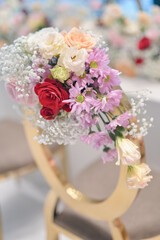 New wedding decoration with multi floral concept indoors. Wedding Ceremony, or wedding receptions. Family intimacy wedding dinner. 