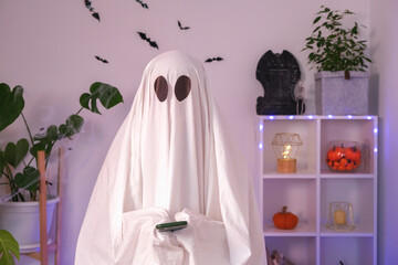 The Halloween Ghost uses a mobile phone to surf the Internet, to browse online stores, markets. The...
