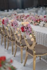 New wedding decoration with multi floral concept indoors. Wedding Ceremony, or wedding receptions. Family intimacy wedding dinner. 