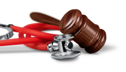 Gavel and stethoscope  on background, symbol photo for bungling and medical error