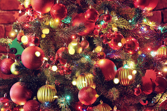 Closeup picture of a christmas tree  decorated with red and green ornaments