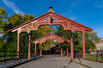 Fototapeta na wymiar The Two gates on the Gamle Bybro or Old Town Bridge in Trondheim, Norway. Gamble Bybro is one of the old town bridges that is used to reach the Bakklandet neighborhood. 