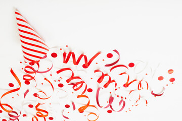 striped birthday hat with confetti on white background