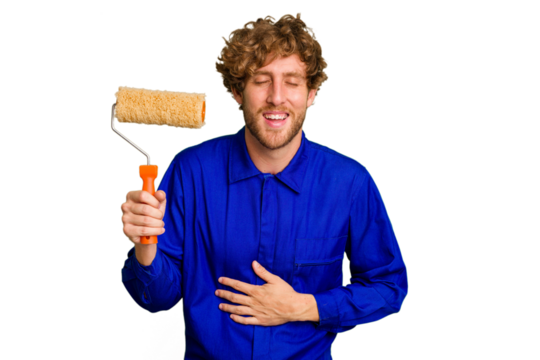 Young painter man holding a roll isolated on white background laughing and having fun.