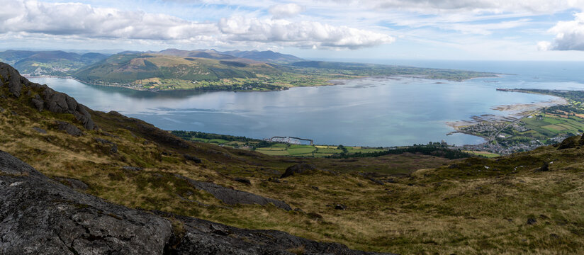 View from Slieve Foy on fields and pastures with beautiful fiords in background. Ireland