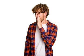 Young caucasian man isolated on green chroma background being shocked because of something she has seen.