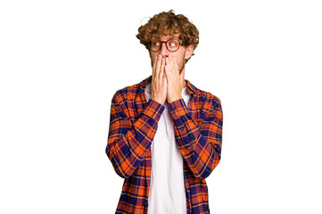 Young caucasian man isolated on green chroma background thoughtful looking to a copy space covering...