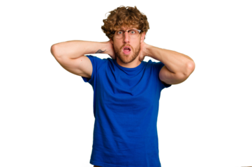 Young caucasian man isolated on green chroma background screaming, very excited, passionate, satisfied with something.