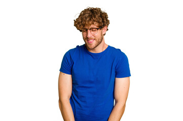 Obraz premium Young caucasian man isolated on green chroma background laughs and closes eyes, feels relaxed and happy.