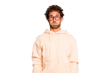 Young caucasian curly hair man isolated Young caucasian man with curly hair isolated blows cheeks, has tired expression. Facial expression concept.