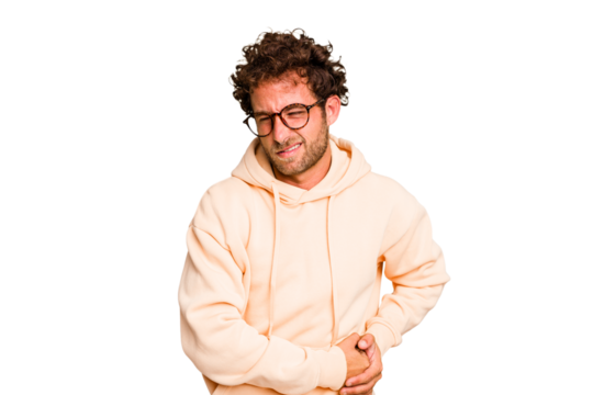 Young caucasian curly hair man isolated Young caucasian man with curly hair isolated having a liver pain, stomach ache.