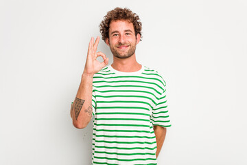 Fototapeta premium Young caucasian curly hair man isolated on white background cheerful and confident showing ok gesture.