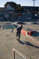 Portrait of young man riding  in skateboard at skatepark  © Sheilby Macena