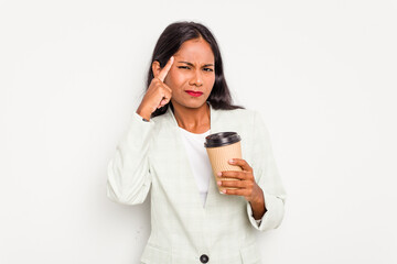 Fototapeta premium Young business Indian woman holding takeaway coffee isolated on white background showing a disappointment gesture with forefinger.
