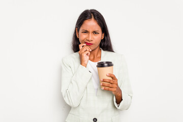 Young business Indian woman holding takeaway coffee isolated on white background biting fingernails, nervous and very anxious.