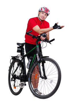 Cyclist next to his bicycle making a presenting jesture