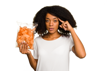 Young African american man holding crips isolated pointing temple with finger, thinking, focused on a task.