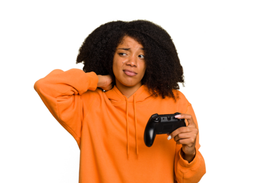 Young African American woman holding a game controller isolated touching back of head, thinking and making a choice.