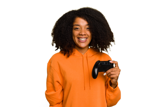 Young African American woman holding a game controller isolated happy, smiling and cheerful. - Powered by Adobe