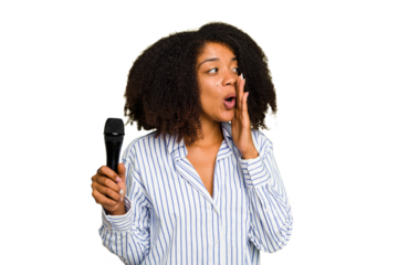 Young African American singer woman holding a microphone isolated is saying a secret hot braking news and looking aside